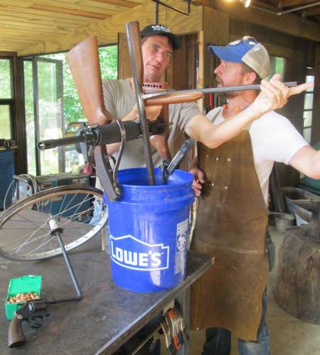 Jason Smith, an artistic blacksmith from Decatur, Georgia, and Jim McGill, PC(USA) mission co-worker in Malawi, work on creating a rope pump out of repurposed guns. Smith made the pump with metal from an AR-15 rifle, a .38 caliber handgun, and two single-barrel shotguns. A wheel from a baby stroller is also part of the design. Commissioned by Columbia Presbyterian Church in Decatur, the pump is the centerpiece of a fundraising effort aimed at purchasing African-made pumps that will be used in Malawi, where thousands of people lack access to safe drinking water. “We just thought it (the pump) would really show what ‘swords into plowshares’ is really all about,” says Tom Hagood, pastor of Columbia Presbyterian. (Photo courtesy of Michael Fitzer, 180 Degrees)