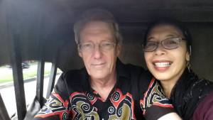 Bernie and Farsi ride in a becak in Aceh