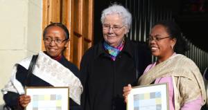 Pastors Yvette Rabemila (l.) and Brigitte Rabaruaona (r.) receive the 2014 Sylvia Michel Prize from the prize’s namesake in Heiden, Switzerland, last March