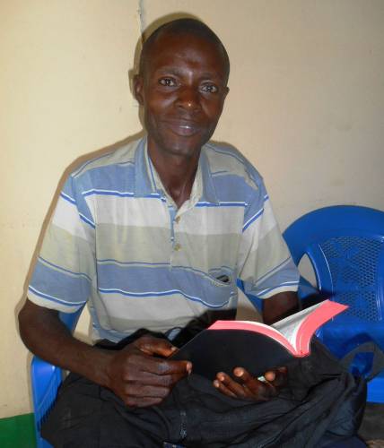 Pastor Emmanuel of a rural parish rejoices in his new Bible! (Kananga)