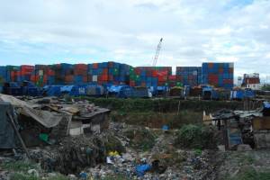 Stacks of shipping containers in the Philippines that companies park near landfill sites. —Frank Dimmock