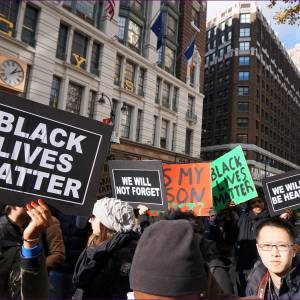 NYC action in solidarity with Ferguson. Missouri, encouraging a boycott of Black Friday Consumerism. (Photo by The All-Nite Images)