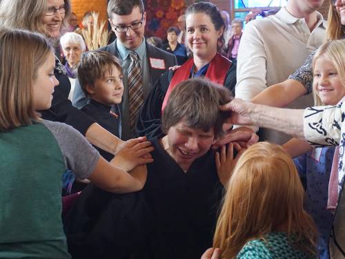 Children lay on hands at Lisa Larges's ordination on Sunday, Oct. 30, 2016; Ben Masters and Kara Root in background. (Photo by Emily Enders Odom)