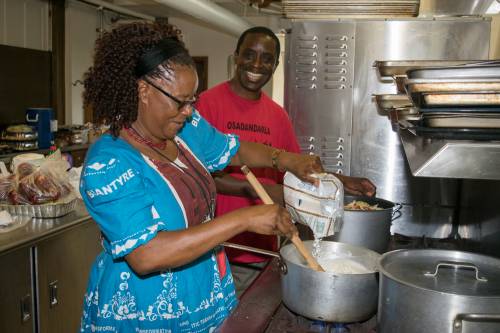 The sister of chef John Pangani, Kamtsitsi Njirammadzi, a member of Chigumula Church of Central Africa Presbyterian, makes nsima (en-see-ma), a popular Malawian dish made of white corn flour and water. Photo by Carl Suppo.