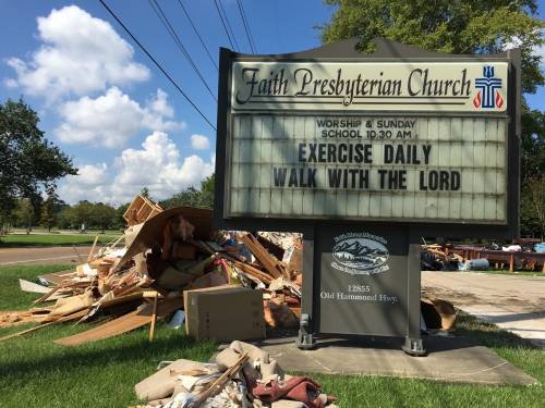 Rubble taken from the church sits outside Faith Presbyterian Church in Baton Rouge, Louisiana. (Photo by Paul Seebeck)