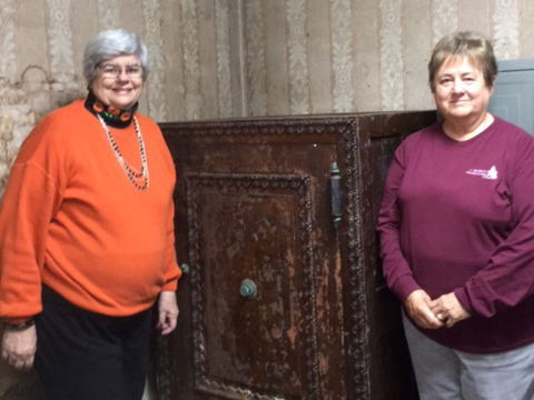 Jill Wiest (left) and Pam Newhouse (right) with the safe at Madison Presbyterian Church. (Photo provided)