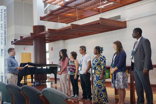 Photo Caption: Carl Horton (left), coordinator for the Presbyterian Peacemaking Program, commissions the 2016 International Peacemakers at the PMA Chapel. (Photo by Mari Graham)