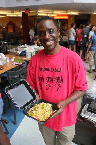 Chef John Pangani holds all that remains of a stir-fried cabbage dish he prepared and delivered from South Bend, Indiana, to New Wilmington, Pennsylvania. Photo by Tammy Warren.