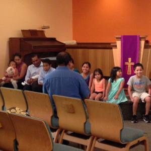 Pastor Miguel talking to Children at Cypress Lake Presbyterian Church. (Photo by Jessica Osegueda)