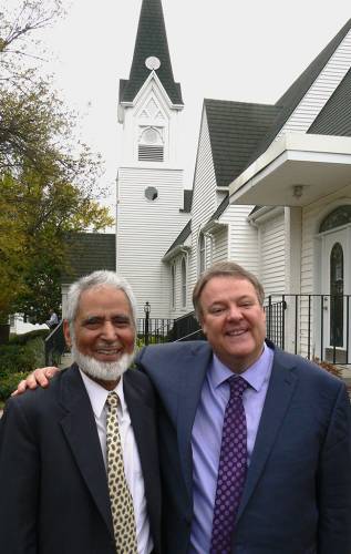 Sayyid Syeed and Scott Prouty outside First Presbyterian Church in Redwood Falls, Minn. (Photo by Duane Sweep)
