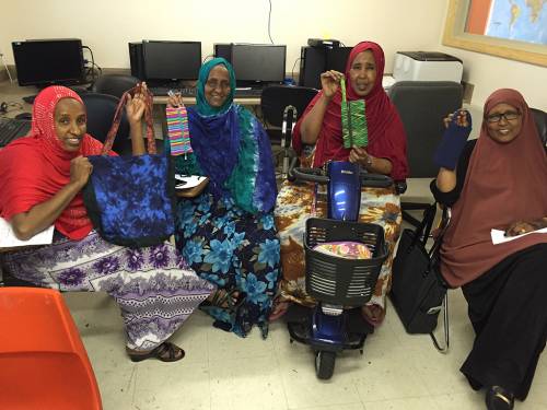 Participants in the Sewing Cooperative at Capital Park, showcase their products. (Photo courtesy of Capital Park)