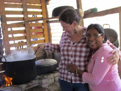 Sarah Henken takes a turn stirring soup with her friend Eunice, one of over 6 million internally displaced persons who are victims of the armed conflict in Colombia. (Photo by Rosaline Maria)