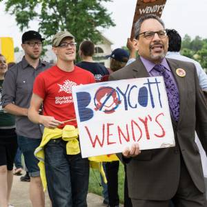 Tony De La Rosa, interim executive director of the Presbyterian Mission Agency, joins the May 26, 2016 protest advocating a boycott of Wendy’s Corporation.