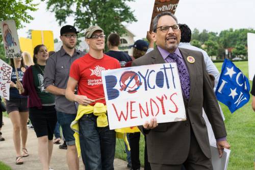 Tony De La Rosa, interim executive director of the Presbyterian Mission Agency, joins the May 26, 2016 protest advocating a boycott of Wendy’s Corporation. 
