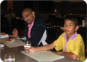 James Riggins, a CVT mission worker alumnus from the American Baptist Churches, shares a meal with a former student from Padoongrasdra School in Phitsanulok