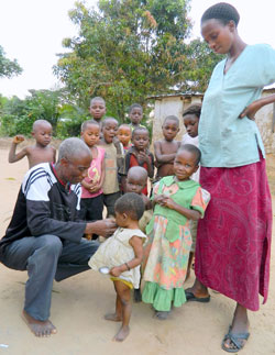 Children being measured for malnutrition