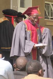 Moses receiving his diploma. The congregation he now pastors has 21 meeting sites! 