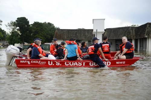 Coast Guardsmen rescue stranded residents from high water during severe flooding around Baton Rouge, La., Aug. 14, 2016. (Photo by Petty Officer 3rd Class Brandon Giles)