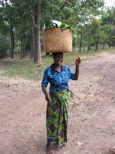 A local woman carrying her produce to market