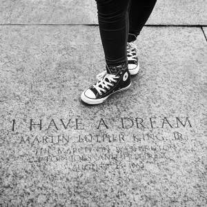 Person standing next to “I Have a Dream” MLK monument