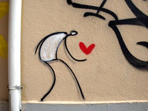 Graffiti of stick figure holding a heart