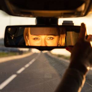 Driver looking in the rear view mirror