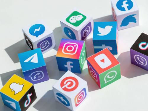Illustration of toy blocks showing the logos of different social media platforms
