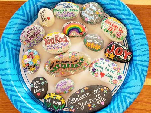 A collection of painted word rocks