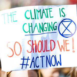 Sign that reads: The climate is changing. So should we! #Act Now.
