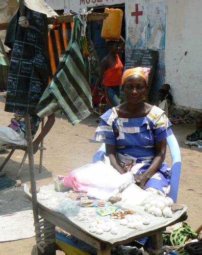 Mamu Ntumba sits at her stall at the market