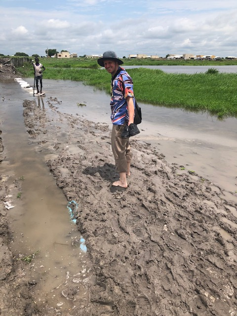 Navigating the mud in Kodok during the rainy season; we traveled during the most difficult times of the year