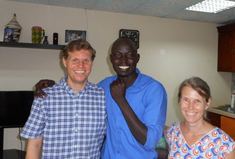 In our home with Peter, the librarian at Nile Theological College.