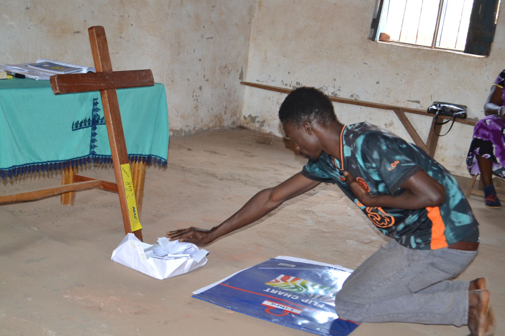A participant during the practicum workshop gives over his pain to Jesus.