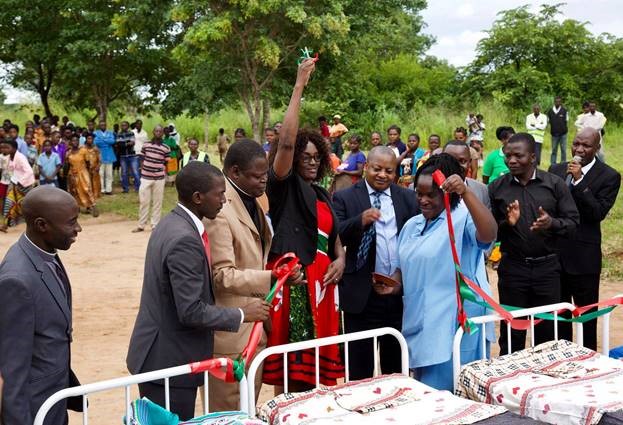 The CCAP Synod Leadership and local government officials cut the ribbon for the 14 new beds given to Egichikeni Rural Health Center because of a generous gift by Liverpool First Presbyterian Church.