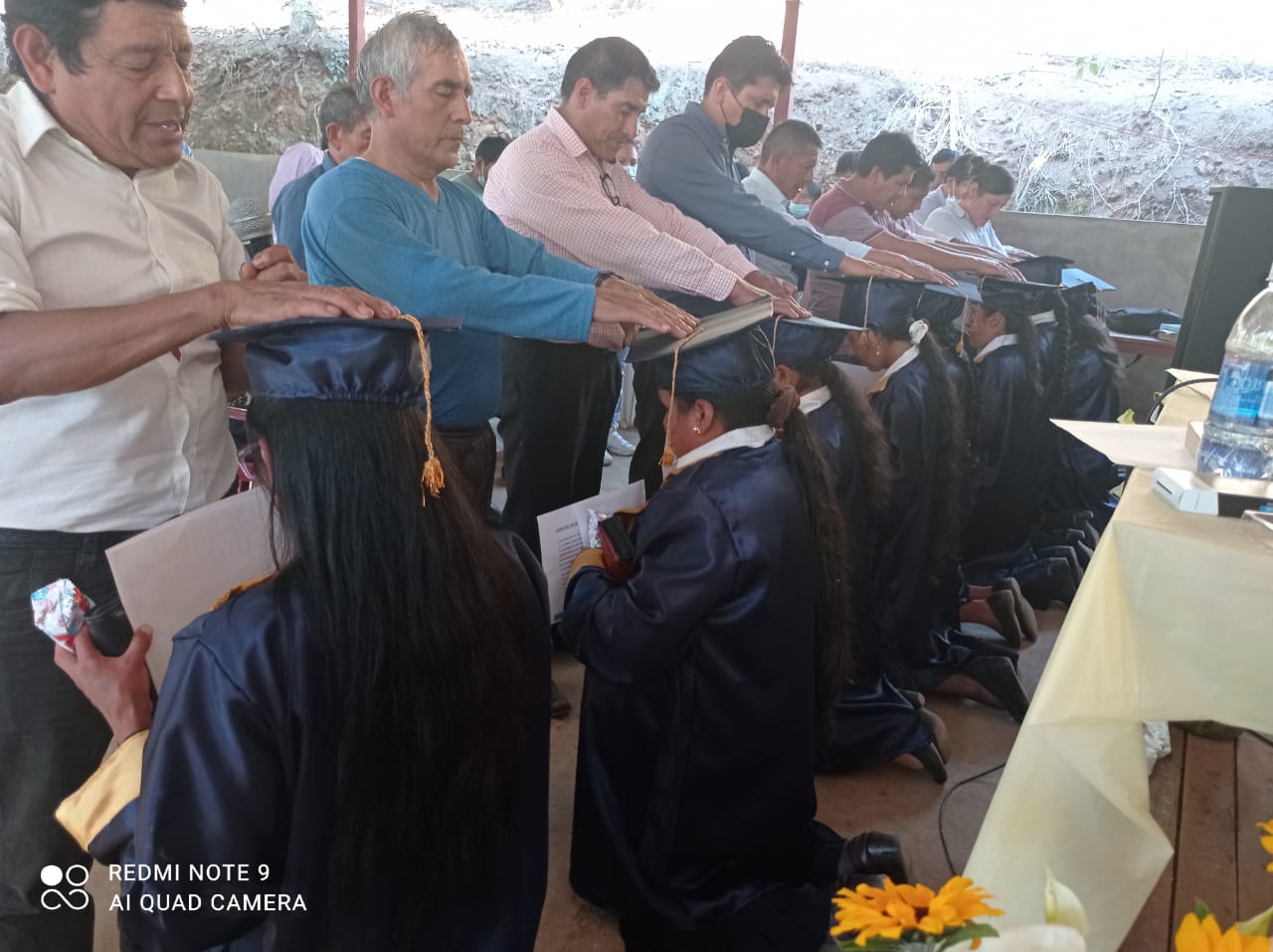 Pastors bless the first women to graduate from the Women's Theology course.