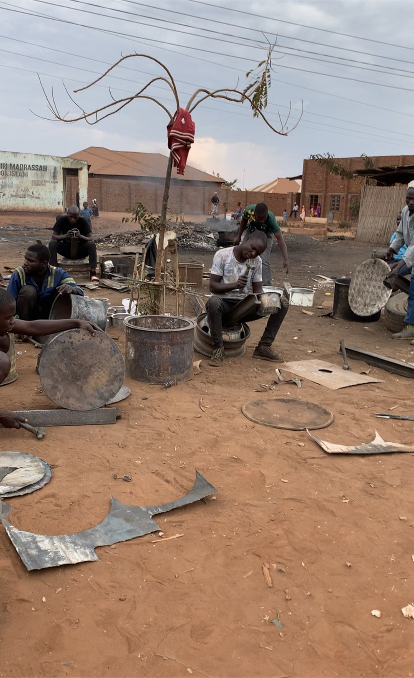 Malawian Artisans making cooking pots.