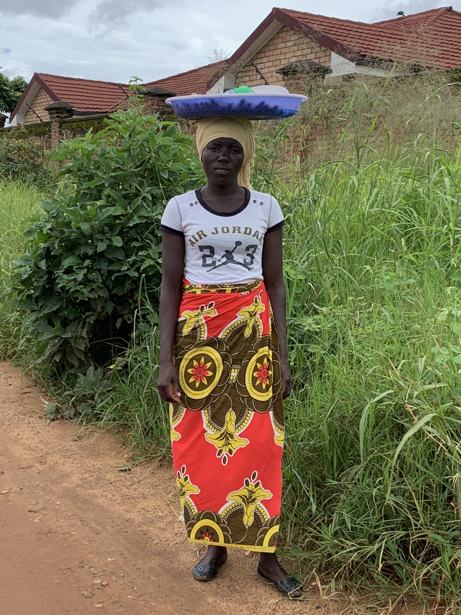 Malawian woman in chitenge skirt. (Photo by Cheryl Barnes)
