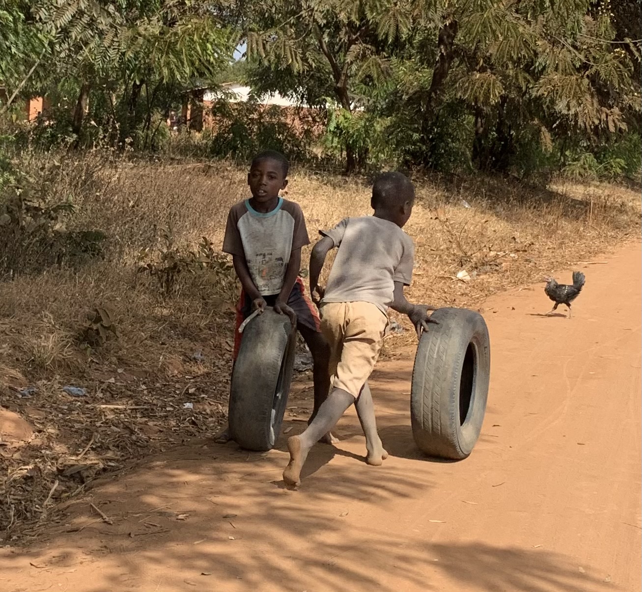 Young boys playing with tires