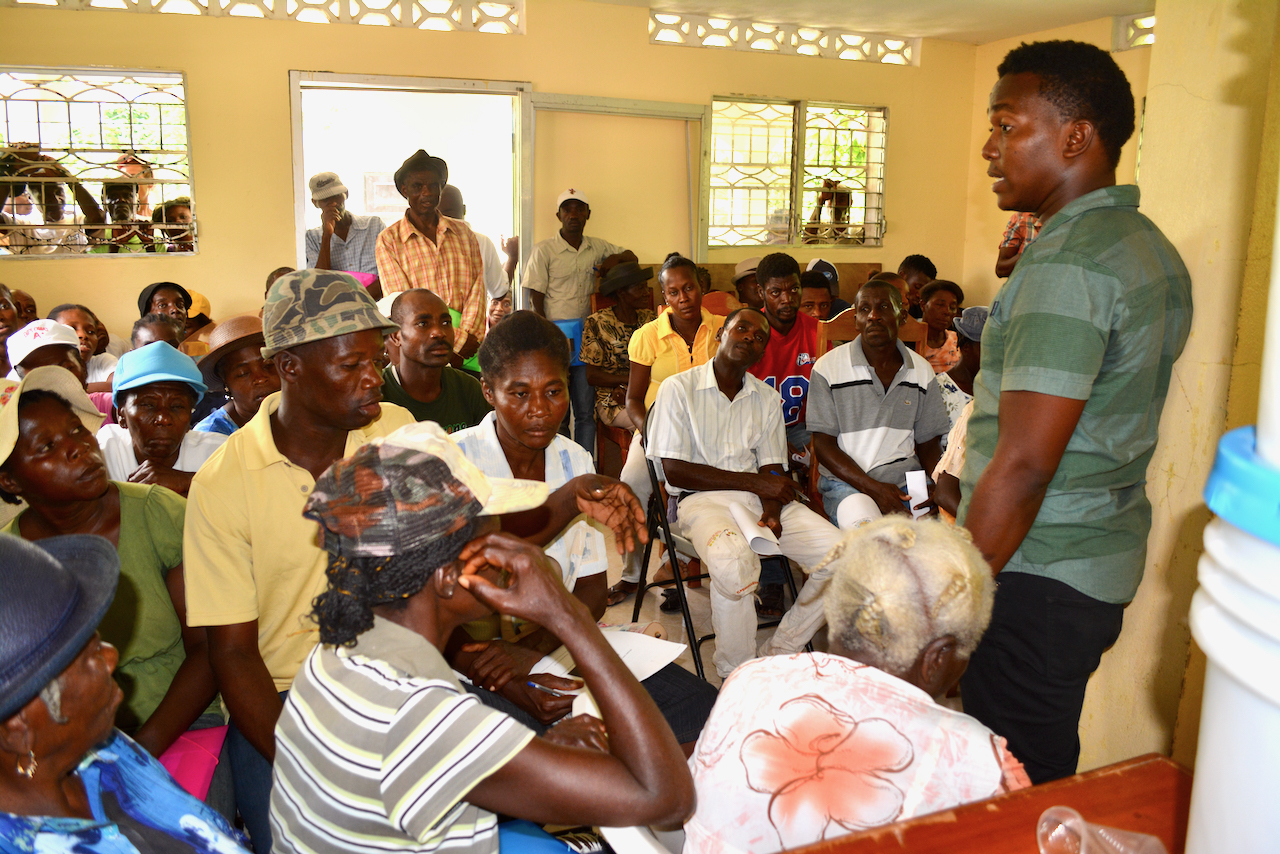A Haitian agronomist collaborates with people affected by Hurricane Matthew during a training session in July 2017 in Camp Perrin. This training was part of a Presbyterian Disaster Assistance funded project through FONDAMA.