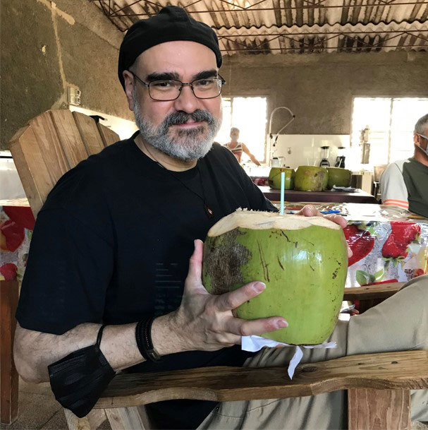 José Manuel enjoys coconut water at the Agroecological Farm in Cardenas