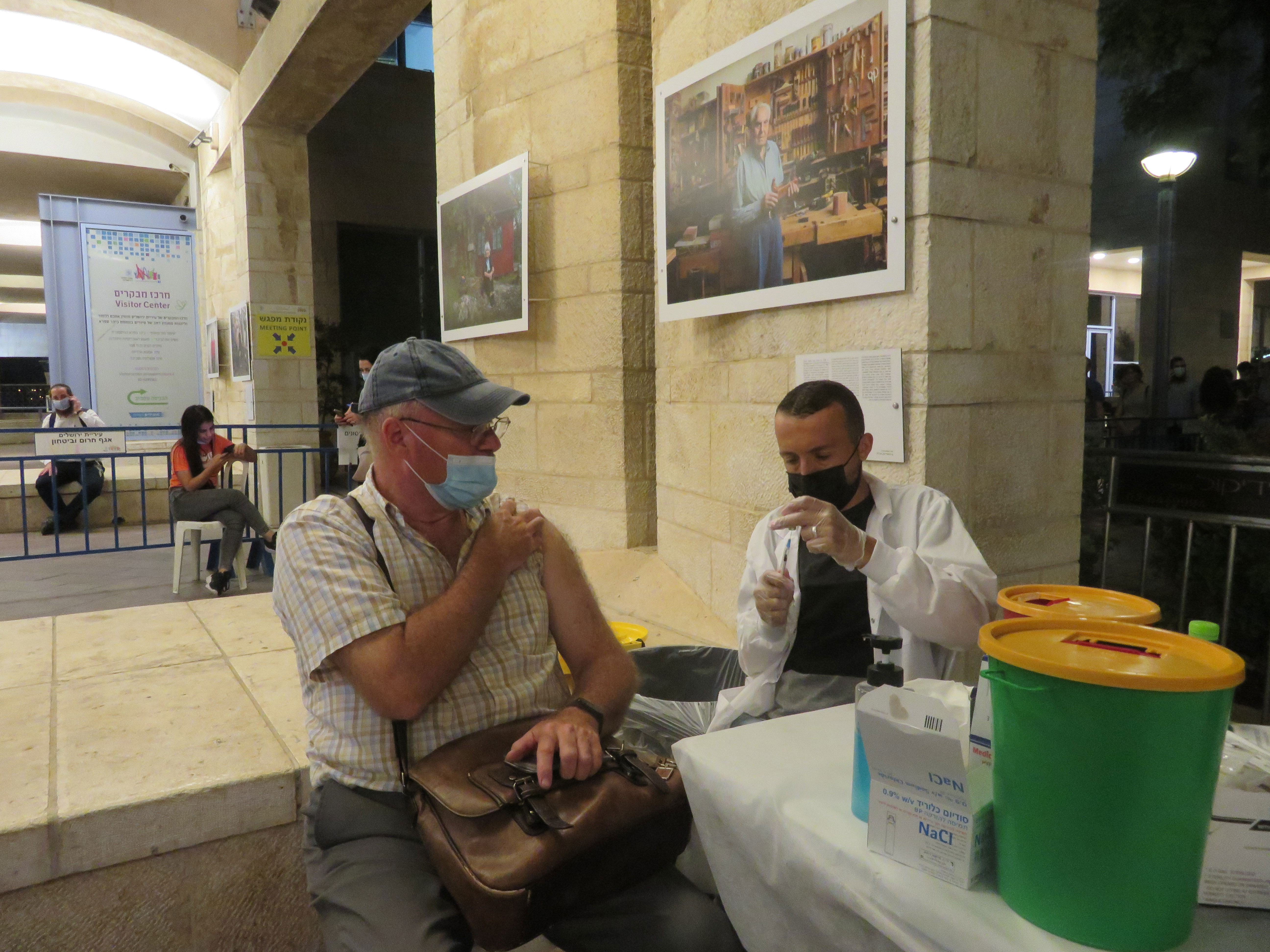 Doug receives the booster vaccine for COVID-19 at Safra Square in Jerusalem on August 29.