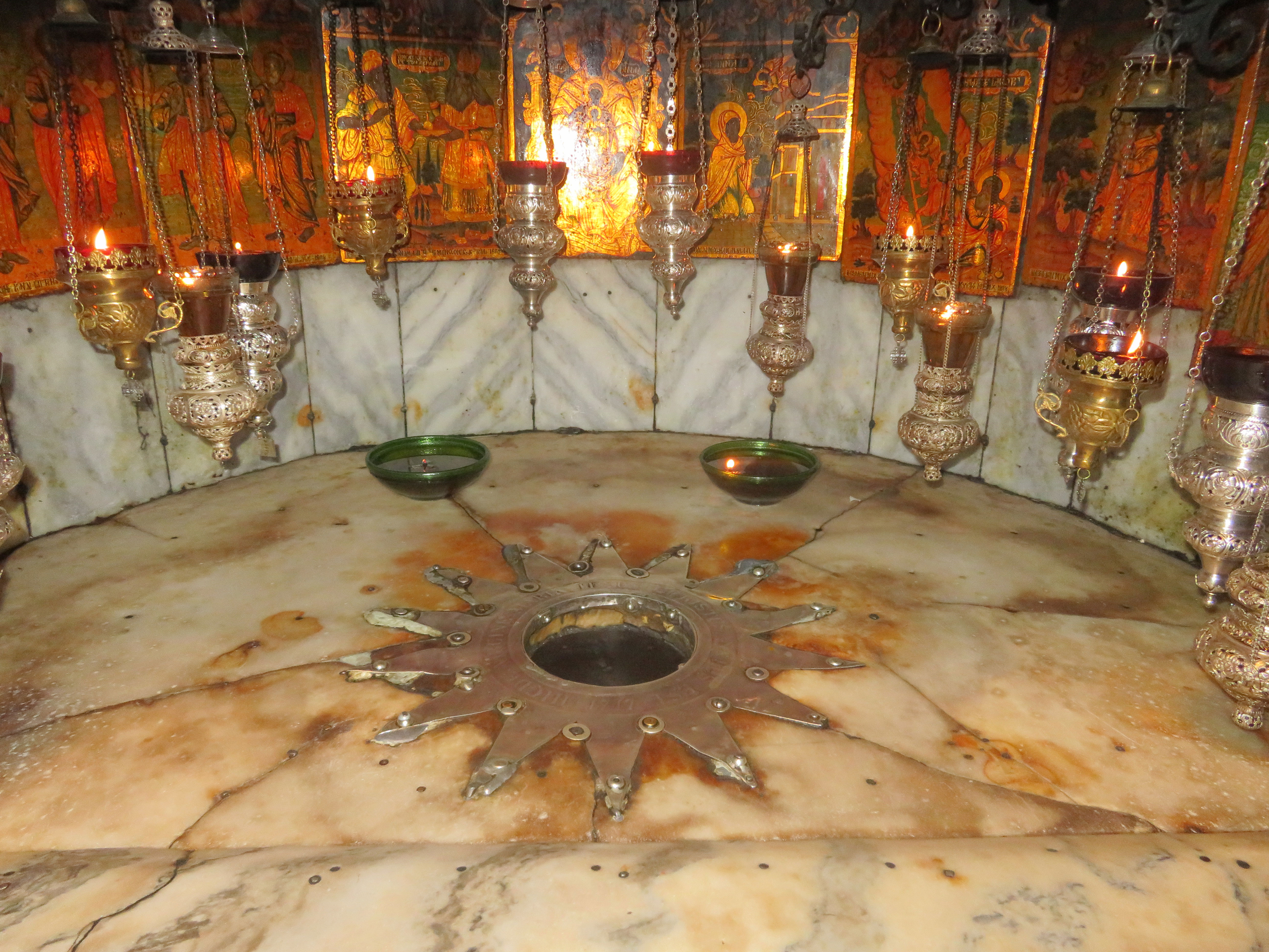 The fourteen-pointed star set in marble marks the place where tradition says Christ was born in Bethlehem’s Church of the Nativity.
