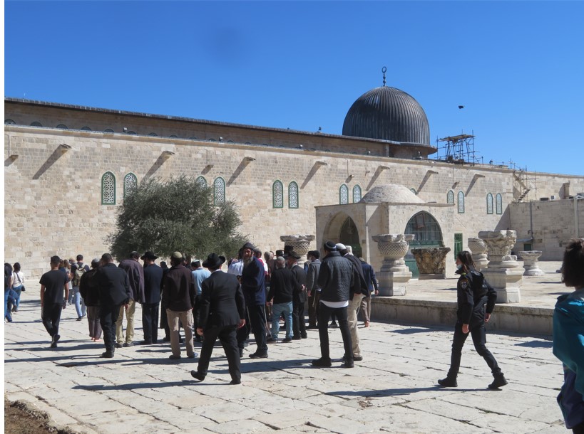 A group of Israeli Jews make their way past the Al Aqsa Mosque on the Haram Al Sharif (Noble Sanctuary) in Jerusalem.