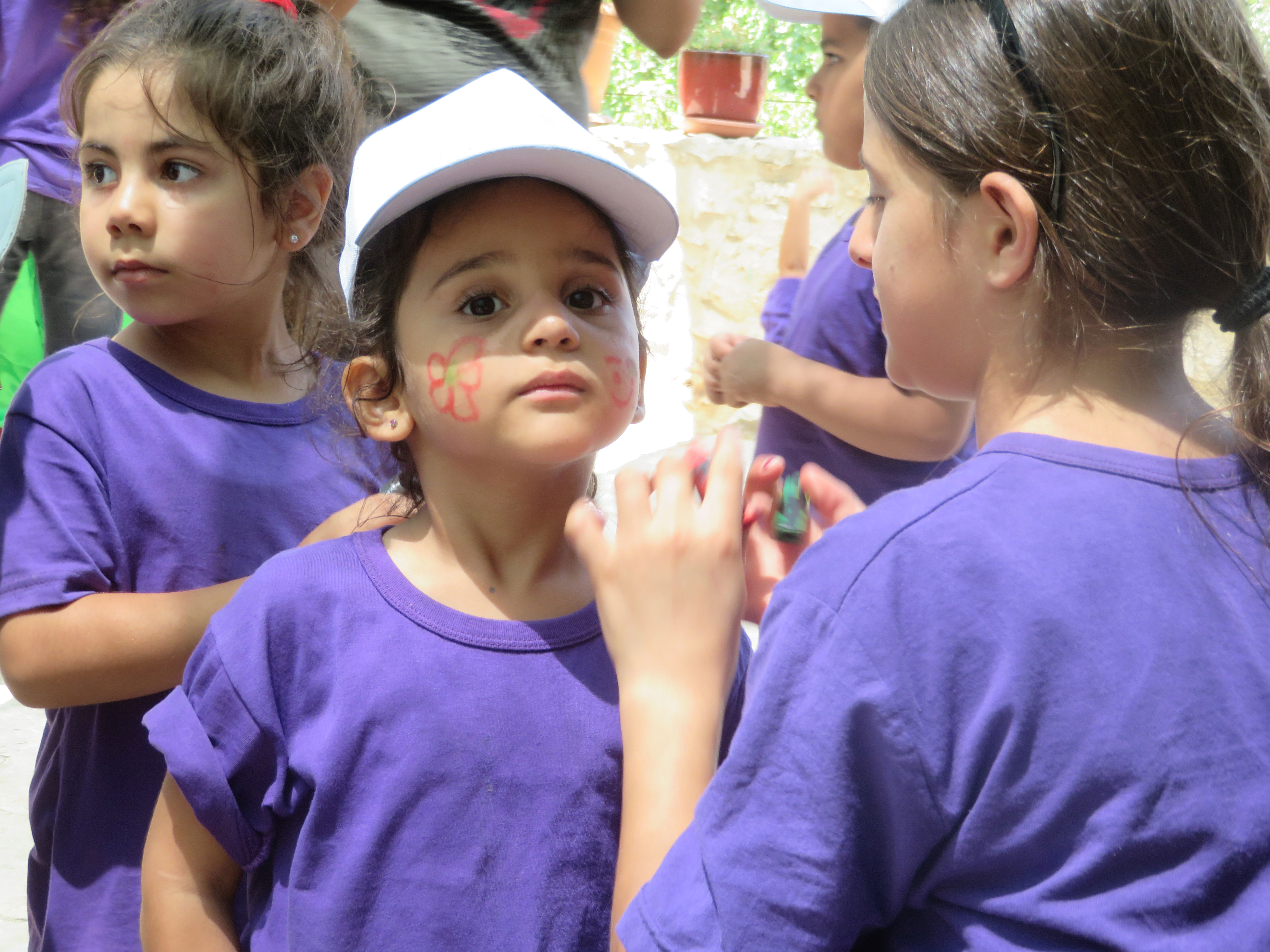 Face-painting at Wi’am’s summer camp for Palestinian Children
