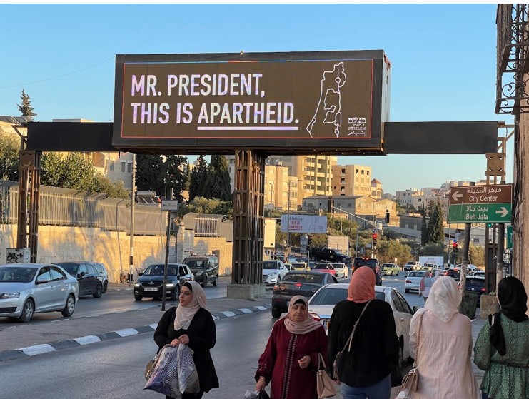 The sign across the main road in Bethlehem reads, “MR. PRESIDENT, THIS IS APARTHEID.”  Photo by Marc Falconer.