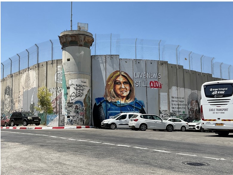 A painting of Shireen Abu Aqla by Palestinian artist Taqi Spateen on Israel’s Apartheid wall, in Bethlehem.