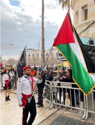 The Palestinian flag is proudly carried in the Christmas Eve parade in Bethlehem.