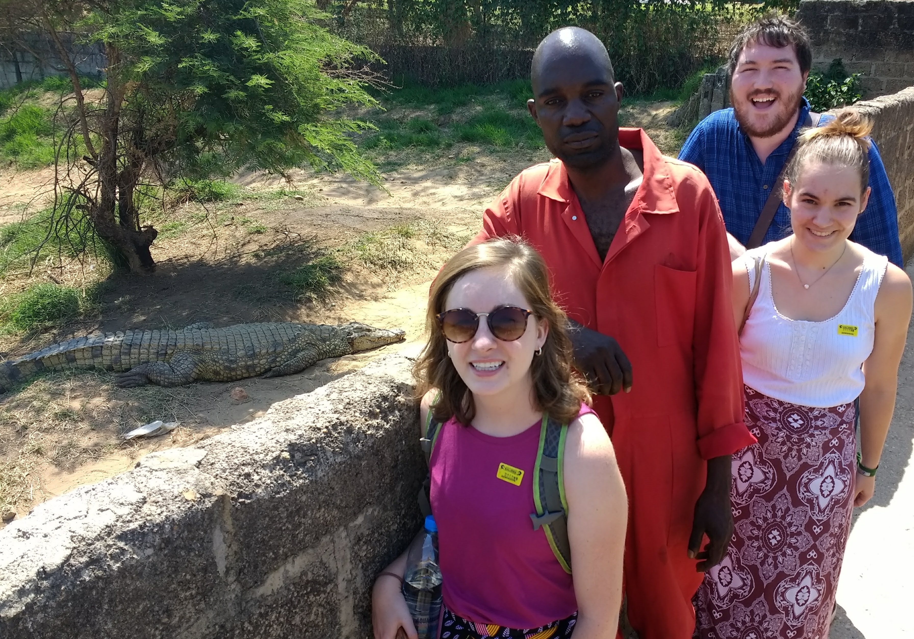 Emily, Miguel, and Sophia (with guide Lovemore … and a crocodile) during the YAVs’ half-day orientation to reptiles of Zambia.
