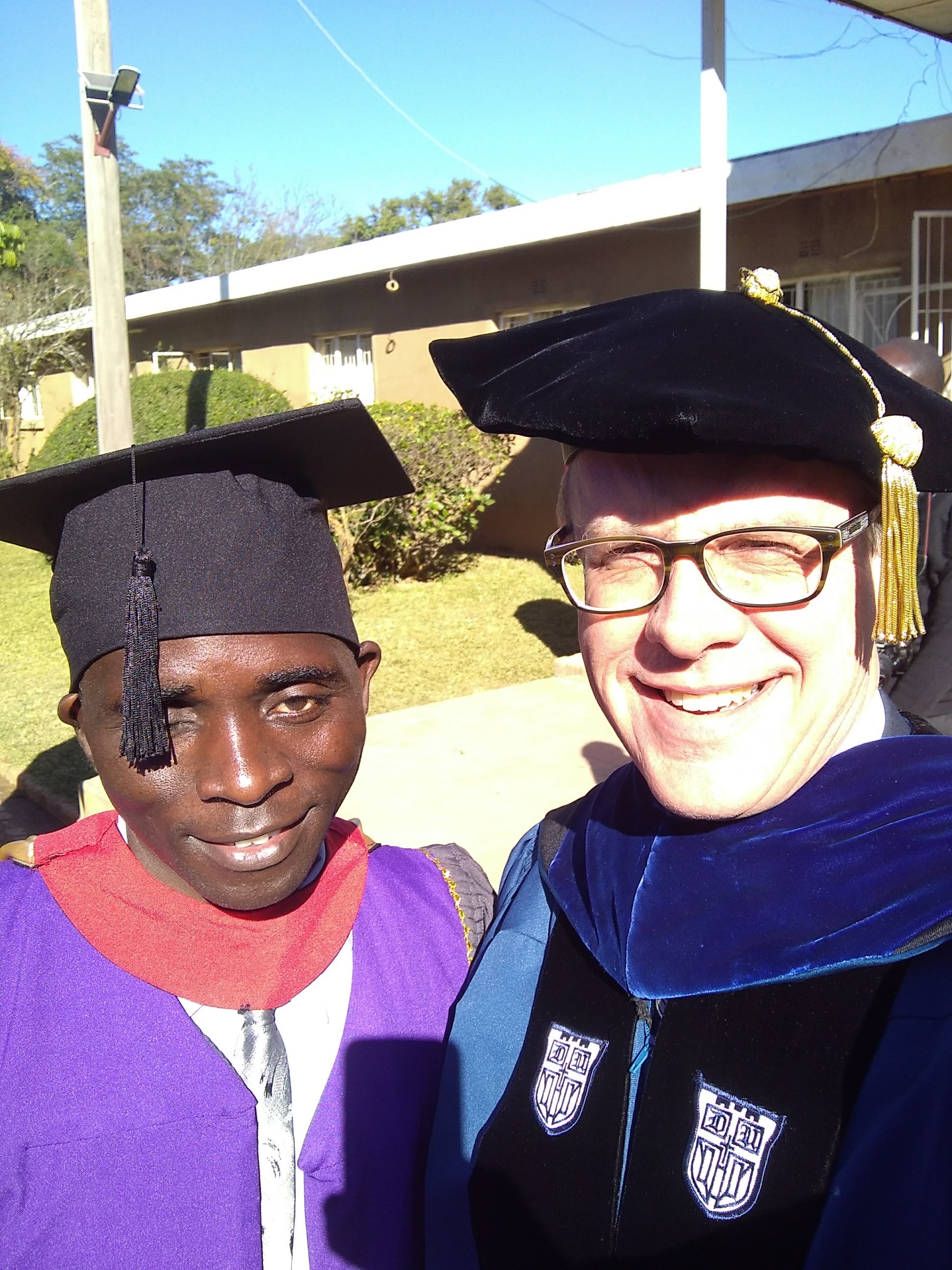 Dustin with Rev. Bannet Muwowo – currently the principal at Chasefu Theological College – celebrating Rev. Muwowo's 2018 masters degree graduation from Justo Mwale University.
