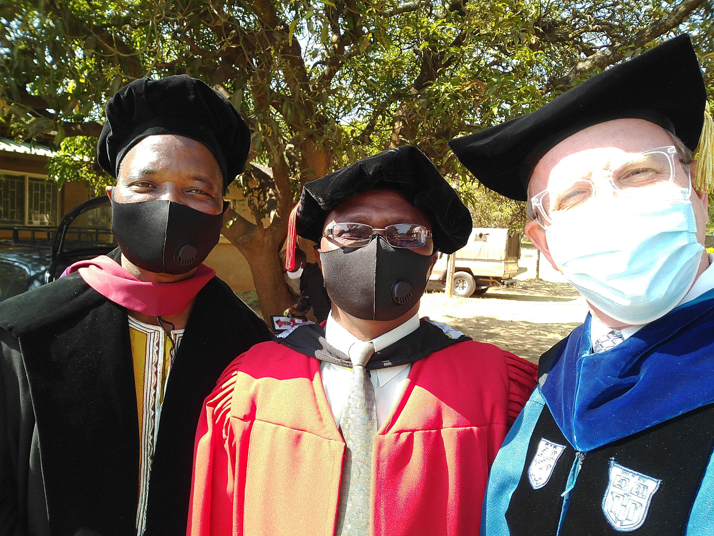 Professors DT Banda, Lameck Banda, and Dustin before entering the graduation ceremony.